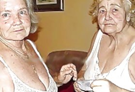 年轻的女朋友在床上轻轻地亲吻和悠闲地抚摸乳头上的乳头